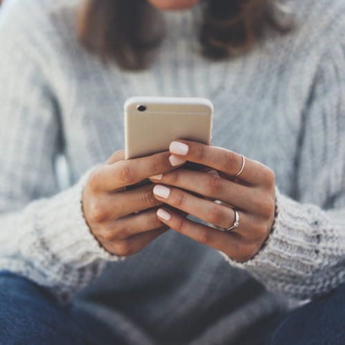 Woman texting on her phone