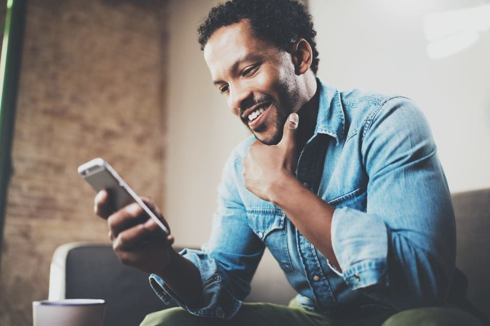 man looking at phone